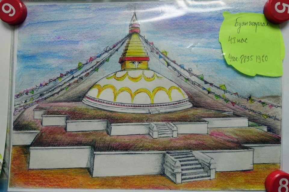 Brightly colored stupa drawing on white paper.