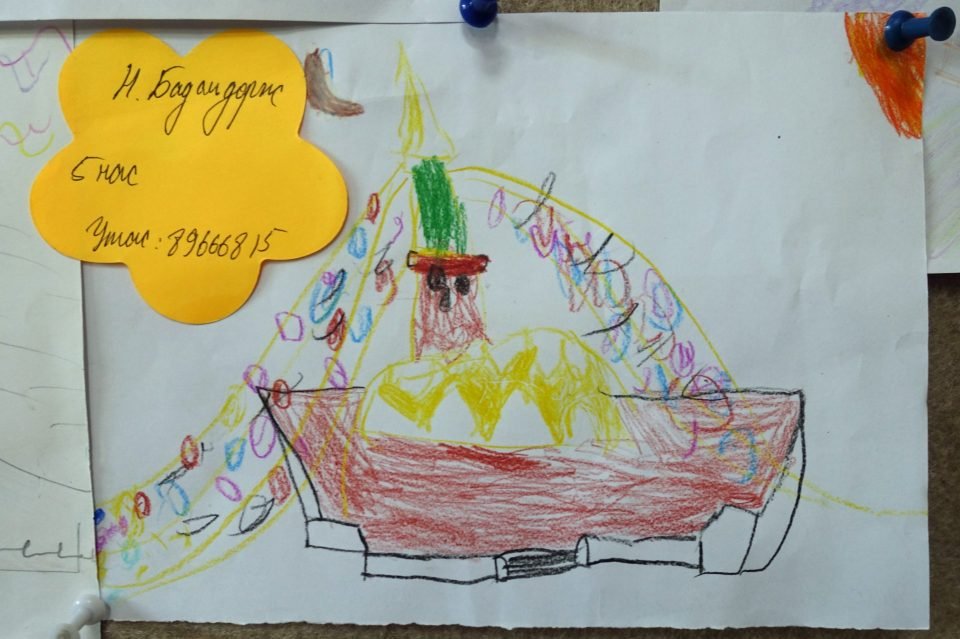 Drawing of a stupa made in colored crayon on white paper.