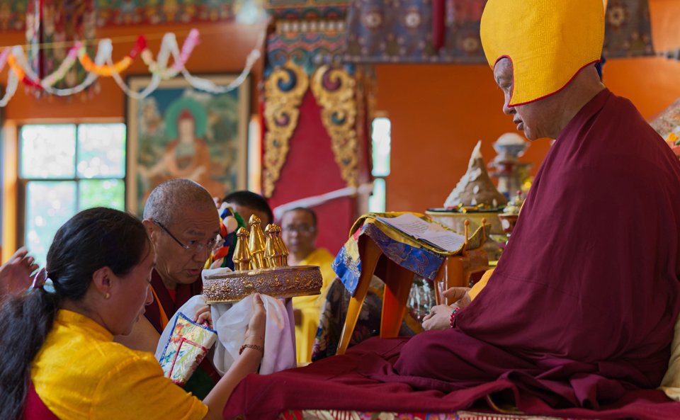 Mandala being offered to Lama Zopa Rinpoche during long life puja