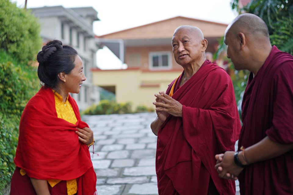 Khadro-la and Lama Zopa Rinpoche outside at Kopan Monastery