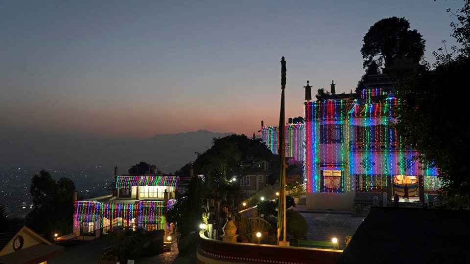 Scenic view of lights on Kopan's gompas and Kathmandu Valley beyond at dusk