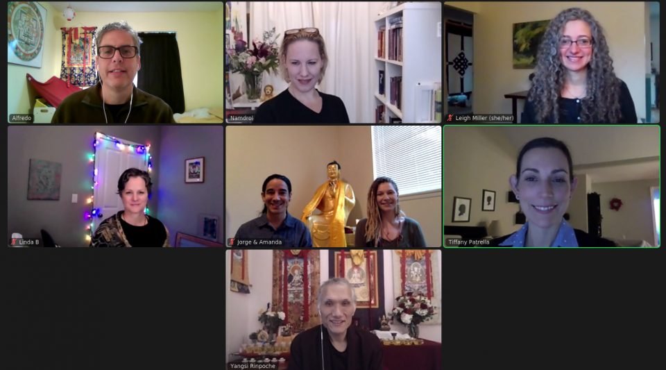 Screenshot of eight people smiling in a Zoom meeting.