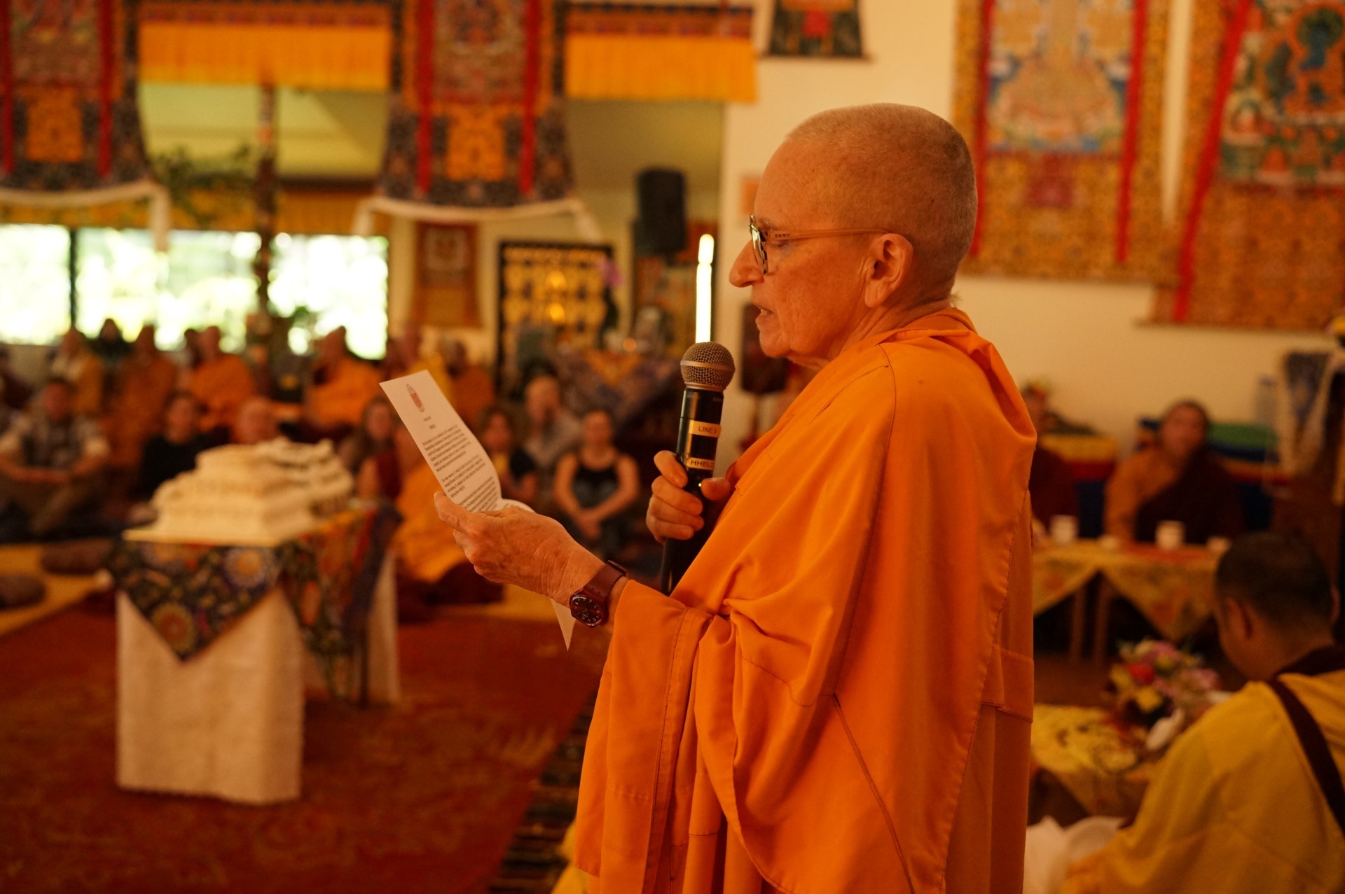 Ven. Elsa Cameron reading a message from His Holiness the Dalai Lama, at Chenrezig Institute July 2026. Photo courtesy of CI.