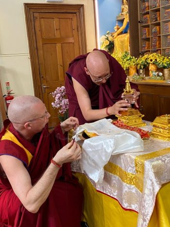 Geshe Tenzin Namdak and Ven. Wangyel welcoming precious holy relics into the gompa, Photo by JBC London Facebook Page.
