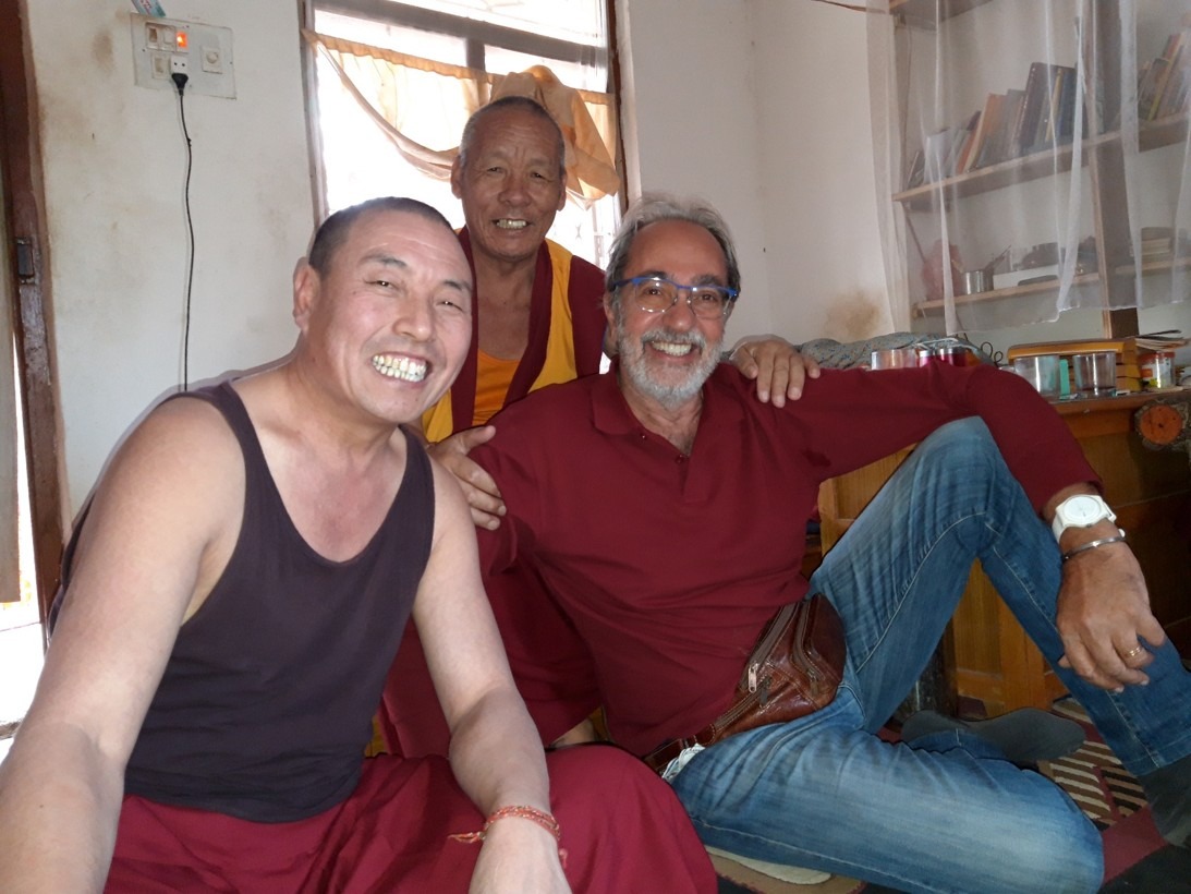 Prof. Neri together with two geshes in the retreat area of Sera Jey Monastery
