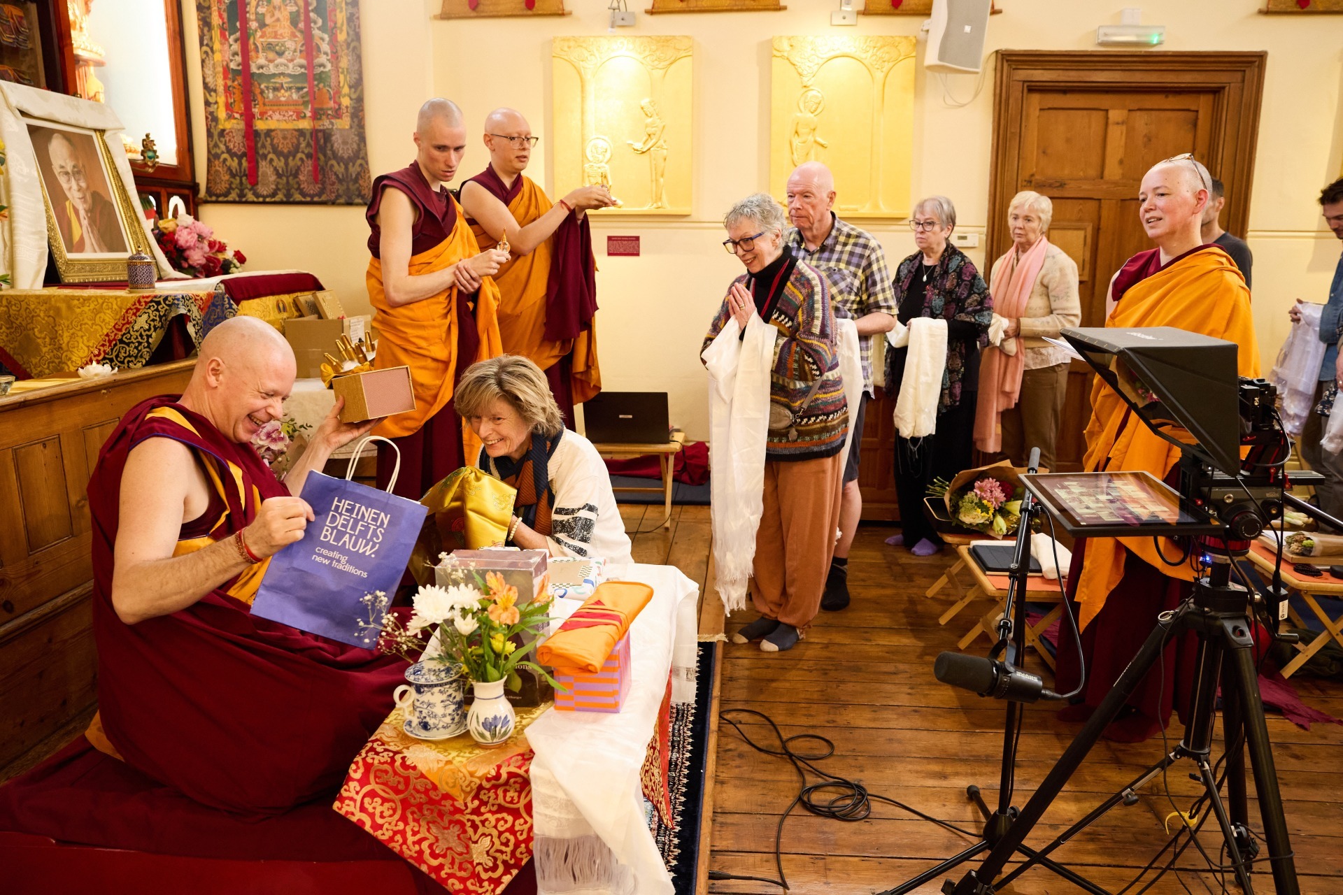 FPMT Basic Program students giving thanks to Geshe Namdak and receiving blessings from relics now housed in the Gompa at Jamyang London. Photo credit of JBC.