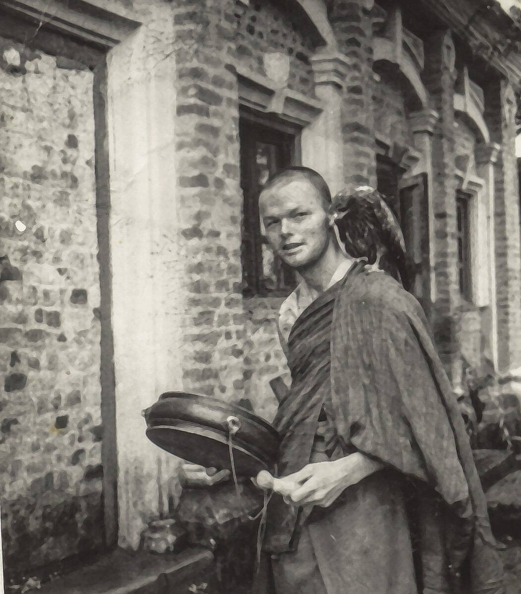 Harry Sutton with a rescued bird he taught to fly and hunt after it was knocked from a tree. The bird became the progenitor of generations of kites living in the Bodhi Tree outside Kopan Monastery. Photo by Merry Collony. 1981, Kopan, Nepal.
