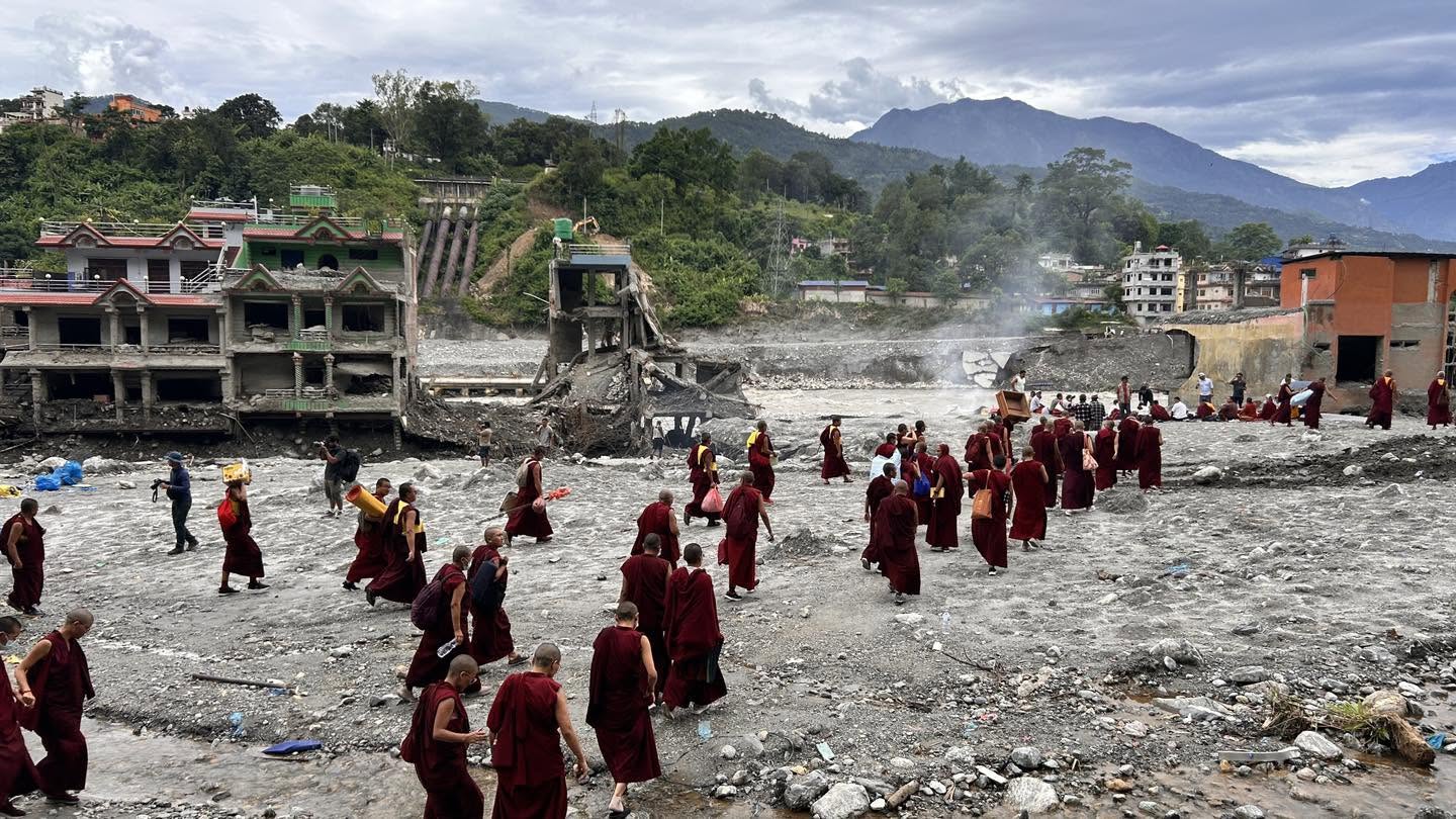 Kopan Sangha walking along the banks of the Trishuli River, September 11. Photo courtesy of the Kopan Monastery School Facebook page.