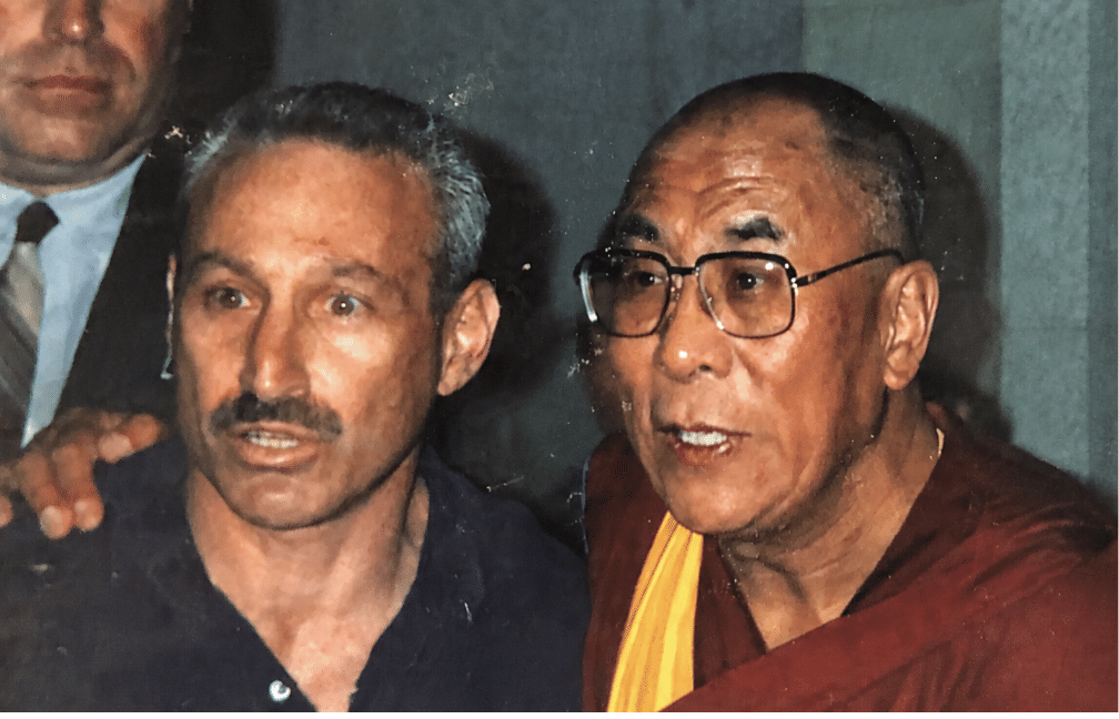 His Holiness the XIV Dalai Lama with Scott Brusso, in visit at Madison Wisconsin 1997. Photo courtesy of Scott Brusso.