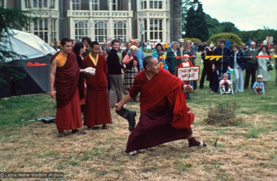 Chris Kolb (Ngawang Chotak), Lama Yeshe and Geshe Tegchok at the Open Day festival at Manjushri Institute, England, 25th of August, 1979. Among the games staged in the gardens was the rural sport of wellie wanging. This consisted of hurling a large rubber Wellington boot as far as possible, from a standing position. Photo courtesy of Lama Yeshe Wisdom Archive.