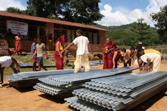 Roof sheets to protect from monsoon rains, Nepal, 2015