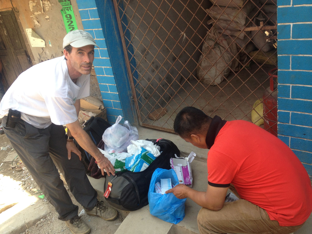 Phil Hunt and Dr. Umesh Mandal with medicines, Nepal, May 2015