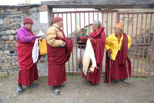 monks-from-mu-monastery-standing-in-the-mist-and-waiting-for-arrival-of-pilgrims-tsum-nepal-may-2018-photo-by-tsum-pilgrimage-participant