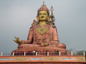 Lama Zopa Rinpoche and students at the large statue of Padmasambhava in Sikkim