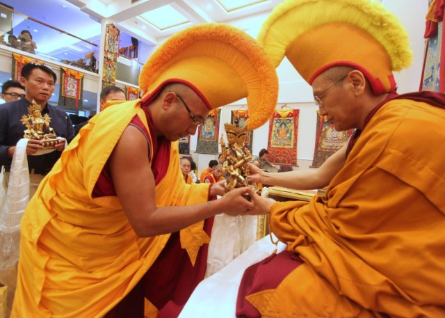 Khen Rinpoche Geshe Chonyi receiving offering from Geshe Sherab at Long Life Puja, Amitabha Buddhist Centre, Singapore, July 2013. Photos courtesy of ABC.