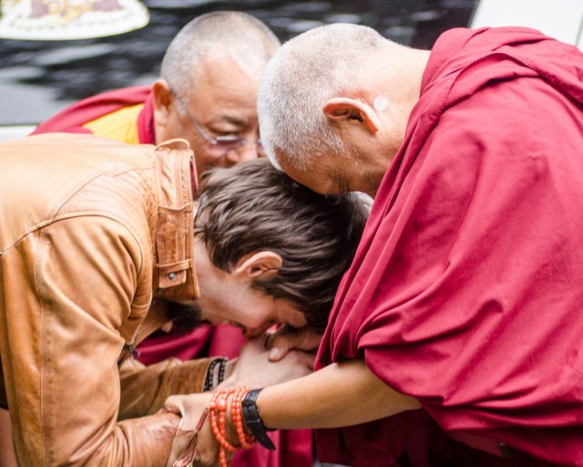 Tenzin Ösel Hita greeting Lama Zopa Rinpoche with Ven. Pemba Sherpa in the background, Land of Medicine Buddha, California, September 21, 2013. Photo by Chris Majors.