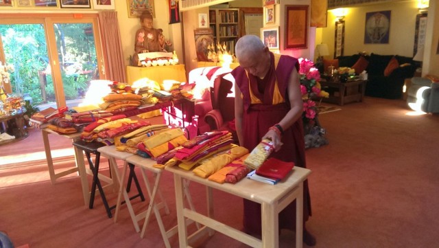 Lama Zopa Rinpoche sorting through his texts, Kachoe Dechen Ling, September 13, 2013 