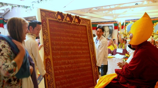 The huge Namgyälma mantra board being presented to Lama Zopa Rinpoche during the long life puja, Land of Medicine Buddha, September 29, 2013. Photo by Ven. Roger Kunsang.