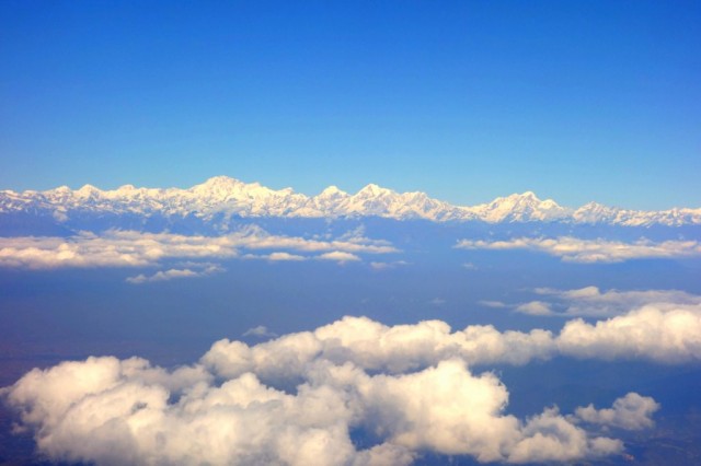 View of the Himalayas from the airplane window, taken during Lama Zopa Rinpoche's journey to Kathmandu, November 22, 2013. Photo by Ven. Roger Kunsang. 