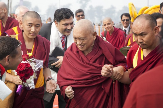 Lama Zopa Rinpoche arriving at foundation stone laying ceremony, Kushinagar, India, December 13, 2013. Photo by Andy Melnic.