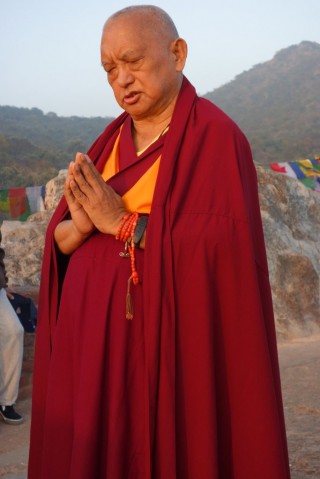 Lama Zopa Rinpoche does prostrations at Vulture's Peak, the site of Buddha's first teaching, India, February 2, 2014. Photo by Ven. Roger Kunsang.
