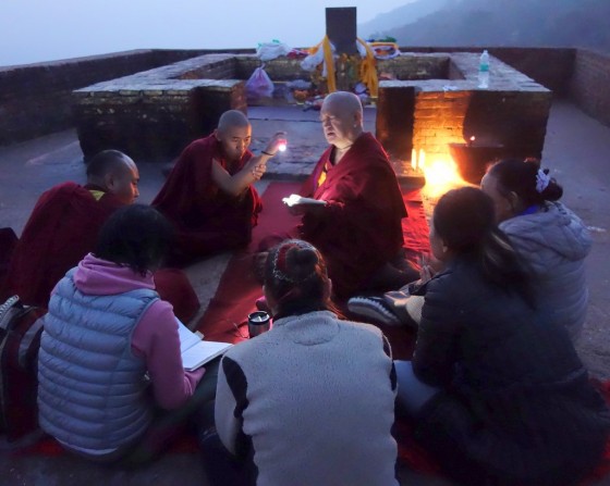 Lama Zopa Rinpoche teaching into the evening on Vulture's Peak, Bihar, India, February 2014. Photo by Ven. Roger Kunsang.