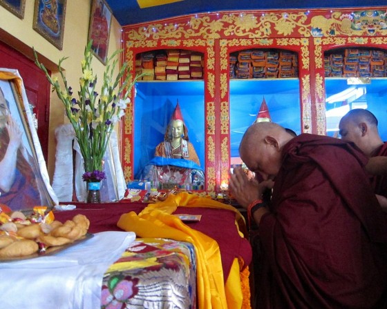 Lama Zopa Rinpoche making offerings to the throne of His Holiness the Dalai Lama on Losar, Root Institute, Bodhgaya, India, March 2014. Photo by Ven. Sarah Thresher.