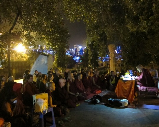Lama Zopa Rinpoche giving oral transmission of Sutra of Golden Light at Mahabodhi Stupa, Bodhgaya, India, March 2014. Photo by Ven. Sarah Thresher.
