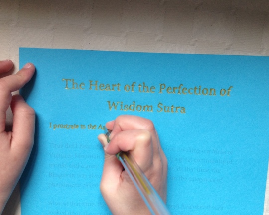 Dechen Bloom hand-tracing the Heart Sutra for Lama Zopa Rinpoche's long life, April 2014