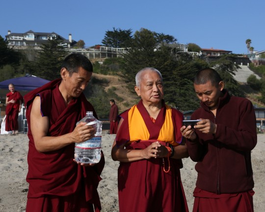 Lama Zopa Rinpoche with Vens. Tsering and Sangpo blessing all the beings in the ocean, California, US, May 2014. Photo by Ven. Thubten Kunsang.