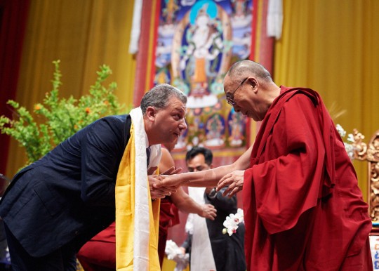 His Holiness the Dalai Lama offering a khata to Filippo Scianna, director of Istituto Lama Tzong Khapa, Livorno, Italy, June 15. Photo by Olivier Adam.