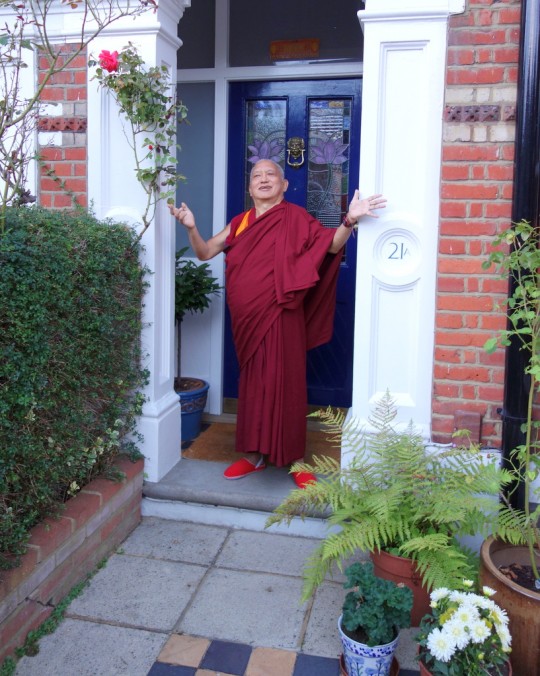 "Lama Zopa Rinpoche leaving the house where he was staying in London, next day was the flight London to the USA. ... Rinpoche is gesturing how much he enjoyed staying there and thanking the kind family who offered their house," share Ven. Roger Kunsang, London, UK, July 2014. Photo by Ven. Roger Kunsang.