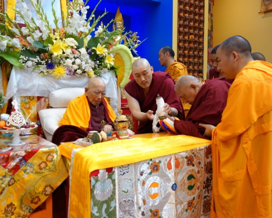 Lama Zopa Rinpoche offering body, speech and mind mandala to Geshe Sopa Rinpoche during the long life puja for Geshe Sopa, Deer Park Buddhist Center, Wisconsin, US, July 20, 2014. Photo by Ven. Roger Kunsang.