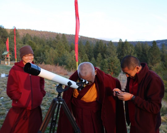 Lama Zopa Rinpoche looking through Lama Yeshe's old telescope, Buddha Amitabha Pure Land, Washington, US, April 2014. Photo Ven. Roger Kunsang.