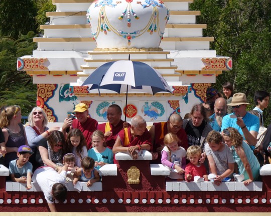 Lama Zopa Rinpoche with the children of Chenrezig Institute releasing butterflies during the 40th anniversary celebration, Eudlo, Queensland, Australia, September 2014. Photo by Ven. Roger Kunsang.