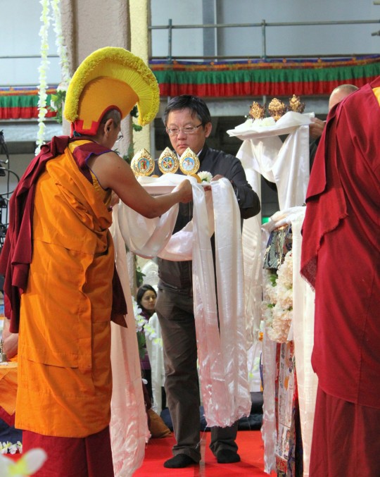 Steve Lin from FPMT Taiwan offering during long life puja, Great Stupa of Universal Compassion, Australia, September 19, 2014. Photo by Laura Miller.