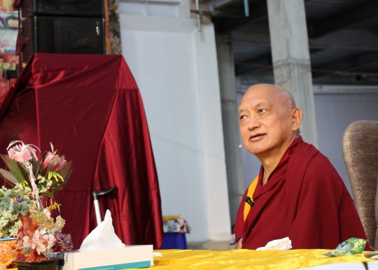 Lama Zopa Rinpoche listening to Andy Wistreich's question during CPMT 2014, Great Stupa of Universal Compassion, Australia, September 2014. Photo by Laura Miller.