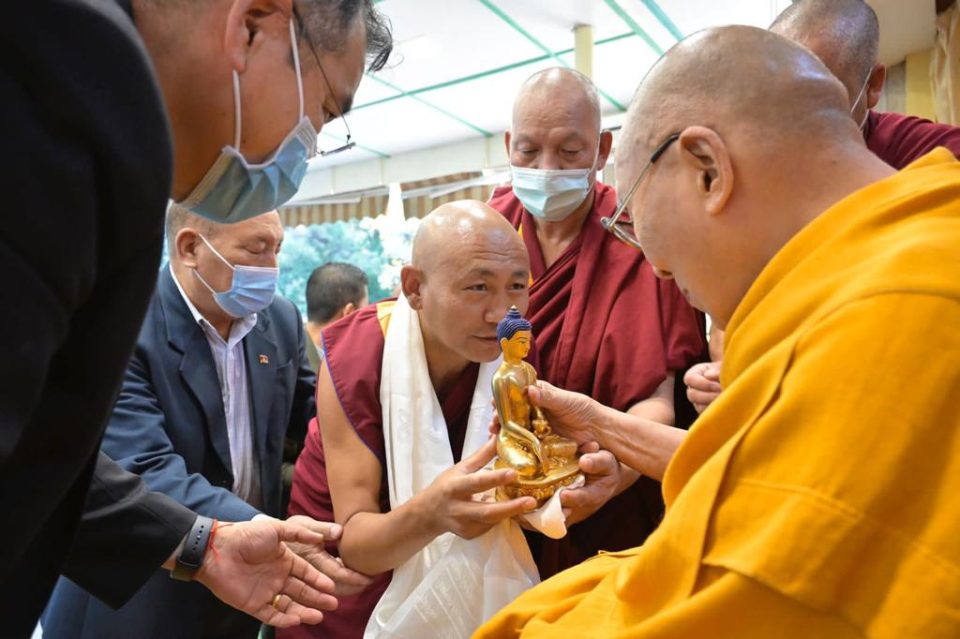 Rejoice in Offering 458 Buddha Statues to His Holiness the Dalai Lama